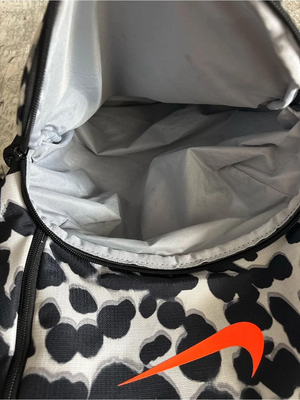 Nike Black and White Spot Pattern Backpack with Orange Swoosh